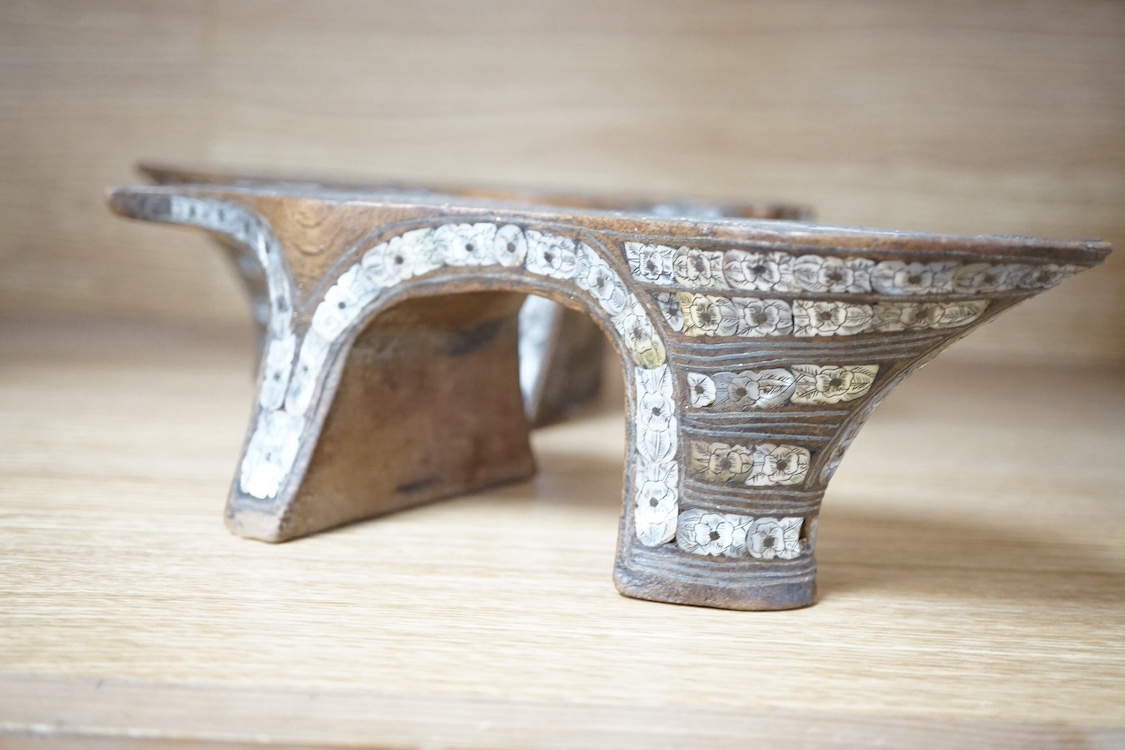 A pair of Islamic wood and engraved mother-of-pearl qabqab (shoes), 25cm wide. Condition - some losses